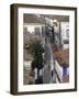Woman in Narrow Alley with Whitewashed Houses, Obidos, Portugal-Merrill Images-Framed Photographic Print