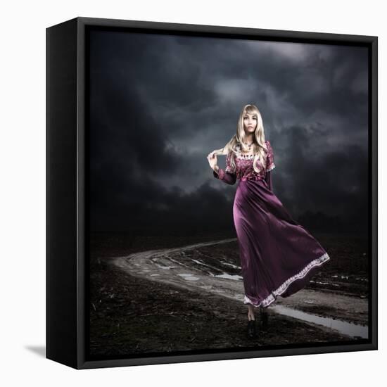 Woman in Purple Dress Walking on Dirty Road-brickrena-Framed Stretched Canvas