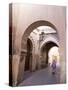 Woman in Traditional Djellaba Dress in Narrow Streets of Old Quarter, Medina, Marrakesh, Morocco-Stephen Studd-Stretched Canvas