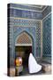Woman in white chador enters Jameh Mosque, Varzaneh, Iran, Middle East-James Strachan-Stretched Canvas