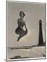 Woman Jumping in Front of Cape Florida Lighthouse, C.1975-null-Mounted Giclee Print