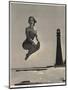 Woman Jumping in Front of Cape Florida Lighthouse, C.1975-null-Mounted Giclee Print