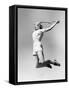 Woman Jumping into the Air with a Tennis Racket in Her Hand-null-Framed Stretched Canvas