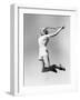 Woman Jumping into the Air with a Tennis Racket in Her Hand-null-Framed Photo