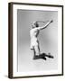 Woman Jumping into the Air with a Tennis Racket in Her Hand-null-Framed Photo