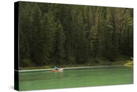 Woman Kayaking On Crystal Clear Waters Of Cliff Lake In Southwest Montana, Near West Yellowstone-Austin Cronnelly-Stretched Canvas