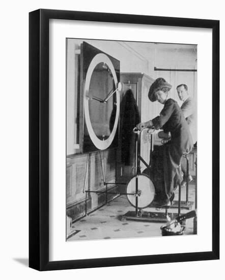 Woman Keeping Fit in the Titanic's Gymnasium-null-Framed Premium Photographic Print