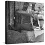 Woman Kissing the Blarney Stone-Hans Wild-Stretched Canvas