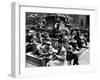 Woman Knitting Among Lunchtime Loungers Relaxing at Base of Statue at New York Public Library-Alfred Eisenstaedt-Framed Photographic Print