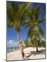 Woman Leaning Against Palm Tree, Princess Cays, Eleuthera Island, West Indies, Caribbean-Richard Cummins-Mounted Photographic Print