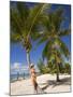 Woman Leaning Against Palm Tree, Princess Cays, Eleuthera Island, West Indies, Caribbean-Richard Cummins-Mounted Photographic Print