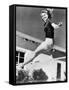 Woman Leaping over a Tennis Net-null-Framed Stretched Canvas