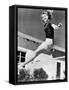 Woman Leaping over a Tennis Net-null-Framed Stretched Canvas