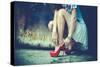 Woman Legs In Red High Heel Shoes And Short Skirt Outdoor Shot Against Old Metal Door-coka-Stretched Canvas