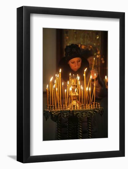 Woman lighting a candle, Trinity Cathedral-Godong-Framed Photographic Print