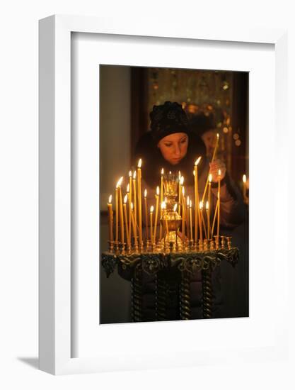 Woman lighting a candle, Trinity Cathedral-Godong-Framed Photographic Print