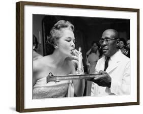 Woman Lighting a Cigarette from a Candle Held by a Waiter at the Piedmont Ball-Paul Schutzer-Framed Photographic Print