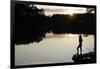 Woman looking out across a lake in rural Finland-David Pickford-Framed Photographic Print