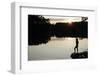 Woman looking out across a lake in rural Finland-David Pickford-Framed Photographic Print