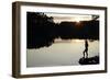 Woman looking out across a lake in rural Finland-David Pickford-Framed Photographic Print