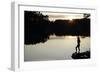 Woman looking out across a lake in rural Finland-David Pickford-Framed Photographic Print