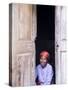 Woman Looks Out from Her Doorway on Ilha Do Mozambique-Julian Love-Stretched Canvas