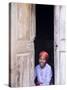 Woman Looks Out from Her Doorway on Ilha Do Mozambique-Julian Love-Stretched Canvas