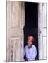 Woman Looks Out from Her Doorway on Ilha Do Mozambique-Julian Love-Mounted Photographic Print