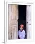 Woman Looks Out from Her Doorway on Ilha Do Mozambique-Julian Love-Framed Photographic Print