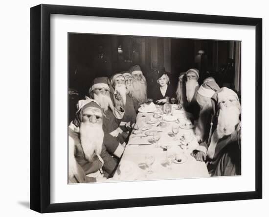Woman Lunching with Twelve Santa Clauses-null-Framed Photo
