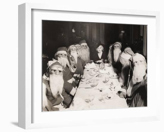 Woman Lunching with Twelve Santa Clauses-null-Framed Photo