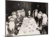 Woman Lunching with Twelve Santa Clauses-null-Mounted Photo