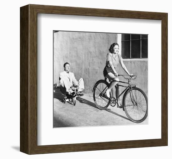 Woman on Bicycle Man Tricycle-null-Framed Art Print