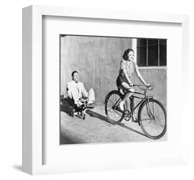 Woman on Bicycle Man Tricycle-null-Framed Art Print