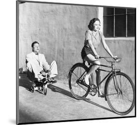 Woman on Bicycle Man Tricycle-null-Mounted Art Print