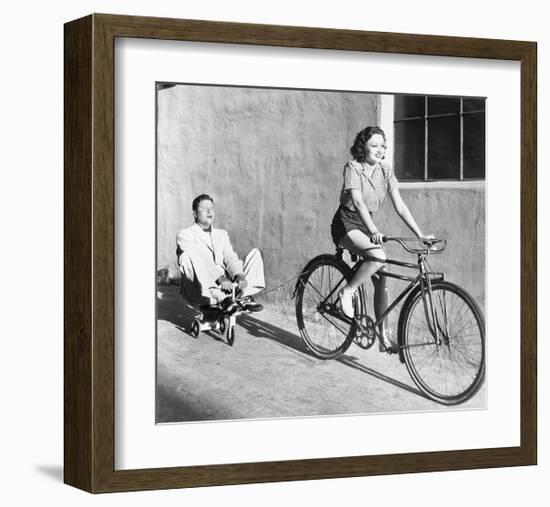 Woman on Bicycle Man Tricycle-null-Framed Art Print