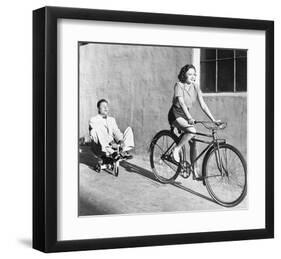 Woman on Bicycle Man Tricycle-null-Framed Art Print