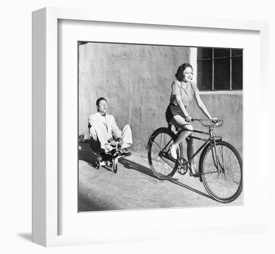 Woman on Bicycle Man Tricycle-null-Framed Art Print