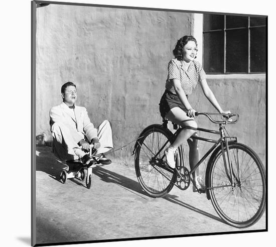 Woman on Bicycle Man Tricycle-null-Mounted Art Print