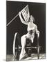 Woman on Cannon Holding American Flag-null-Mounted Photo