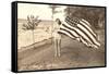 Woman on Shore Holding Flag-null-Framed Stretched Canvas