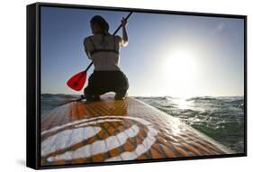 Woman on Stand Up Paddle-Board Heads into the Sunset at San Onofre Beach, San Clemente, California-Louis Arevalo-Framed Stretched Canvas