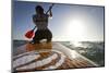 Woman on Stand Up Paddle-Board Heads into the Sunset at San Onofre Beach, San Clemente, California-Louis Arevalo-Mounted Photographic Print