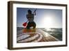 Woman on Stand Up Paddle-Board Heads into the Sunset at San Onofre Beach, San Clemente, California-Louis Arevalo-Framed Photographic Print