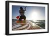 Woman on Stand Up Paddle-Board Heads into the Sunset at San Onofre Beach, San Clemente, California-Louis Arevalo-Framed Photographic Print