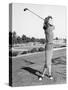 Woman on the Driving Range Swinging a Golf Club-null-Stretched Canvas