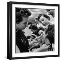 Woman Piercing Another Woman's Ears as Friends Look On-Robert W^ Kelley-Framed Photographic Print