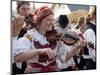 Woman Playing Violin and Wearing Folk Dress, Borsice, Brnensko, Czech Republic-Richard Nebesky-Mounted Photographic Print