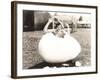 Woman Popping Out of Giant Egg-null-Framed Photo