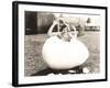 Woman Popping Out of Giant Egg-null-Framed Photo